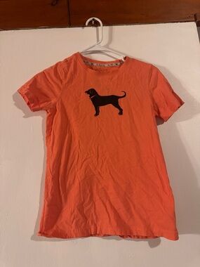 The Black Dog Orange Tee with Black Dog Silhouette